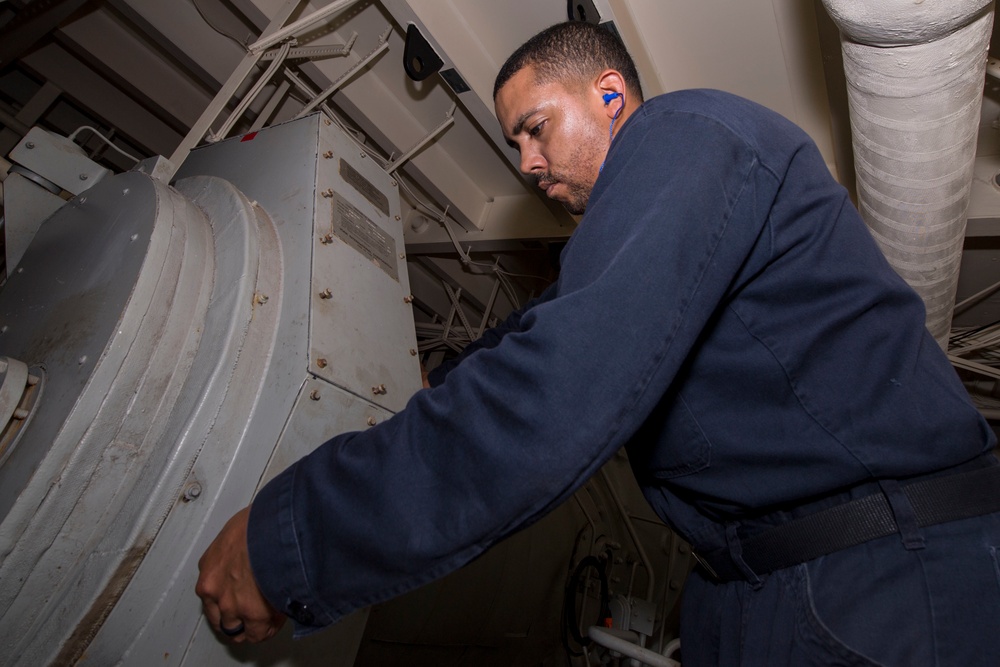 USS America Sailor quality checks air conditioning unit