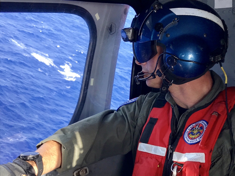 Coast Guard MH-65 Dolphin helicopter crew searches for Army aviators off Oahu