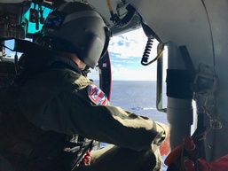 Coast Guard MH-65 Dolphin crew searches for missing Army aviators off Oahu