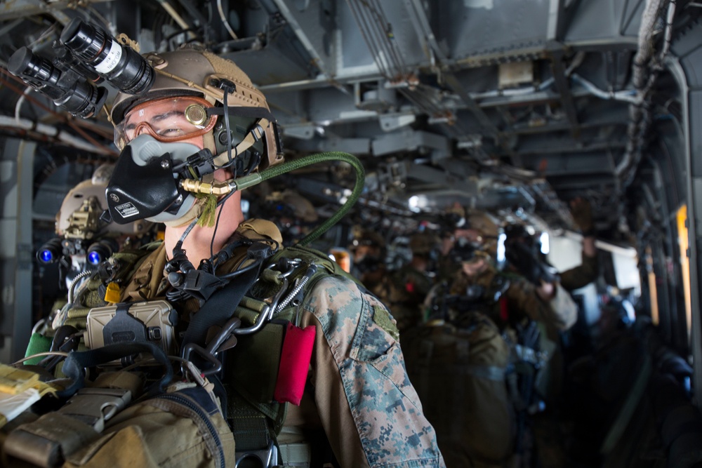 Force Recon Marines perform high altitude-high opening jumps in Yausubetsu