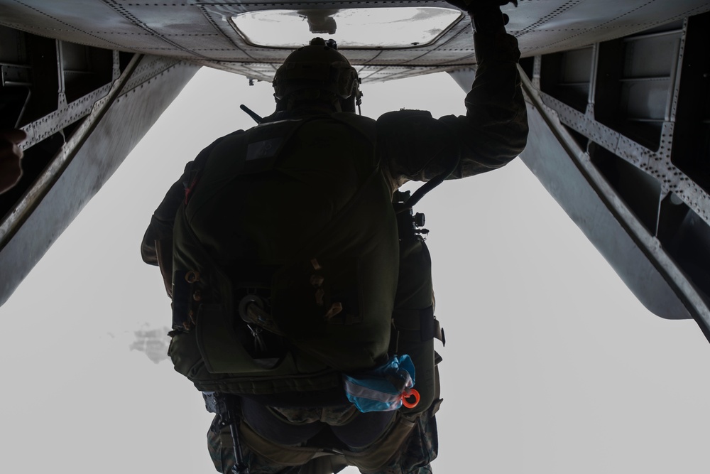 Force Recon Marines perform high altitude-high opening jumps in Yausubetsu