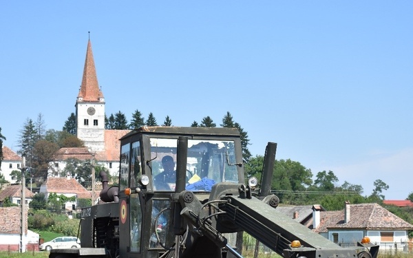 Engineers grade soccer field in Romania