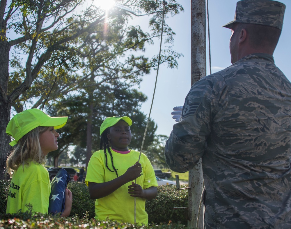 Honor Guard teaches school safety patrol flag etiquette