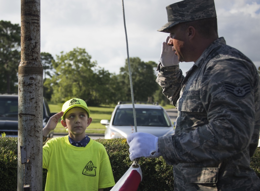 Honor Guard teaches school safety patrol flag etiquette