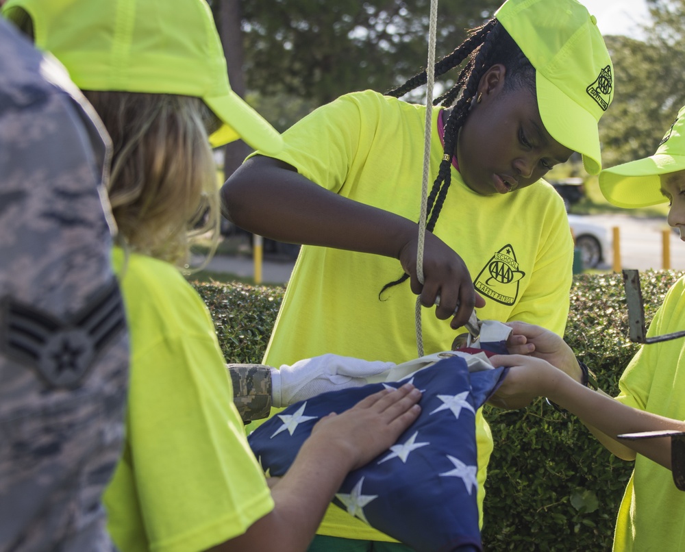 Honor Guard teaches school safety patrol flag etiquette