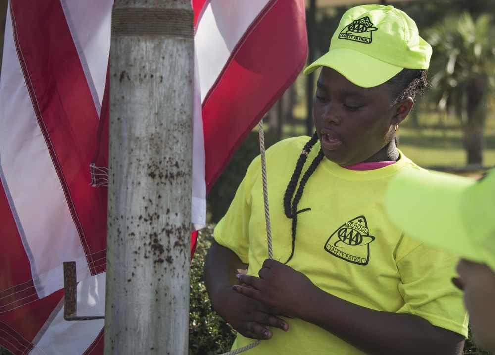 Honor Guard teaches school safety patrol flag etiquette