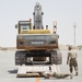 Heavy equipment loaded onto C-17 Globemaster III for transport across the AOR