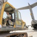 Heavy equipment loaded onto C-17 Globemaster III for transport across the AOR