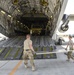 Heavy equipment loaded onto C-17 Globemaster III for transport across the AOR