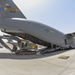 Heavy equipment loaded onto C-17 Globemaster III for transport across the AOR