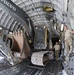 Heavy equipment loaded onto C-17 Globemaster III for transport across the AOR