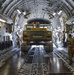 Heavy equipment loaded onto C-17 Globemaster III for transport across the AOR