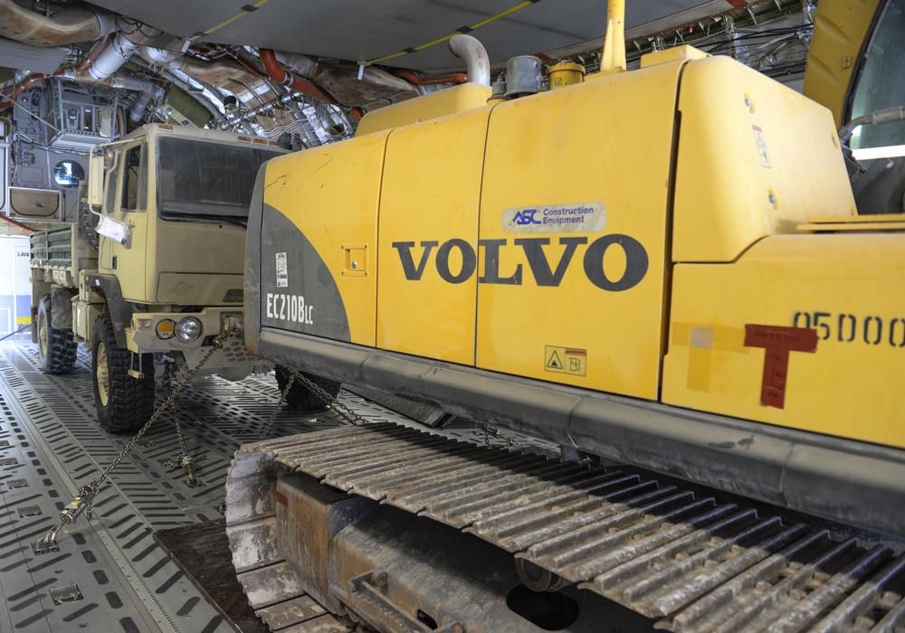 Heavy equipment loaded onto C-17 Globemaster III for transport across the AOR