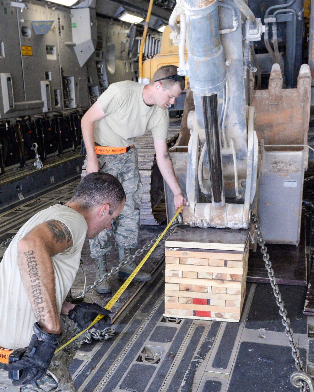 Heavy equipment loaded onto C-17 Globemaster III for transport across the AOR