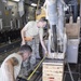 Heavy equipment loaded onto C-17 Globemaster III for transport across the AOR