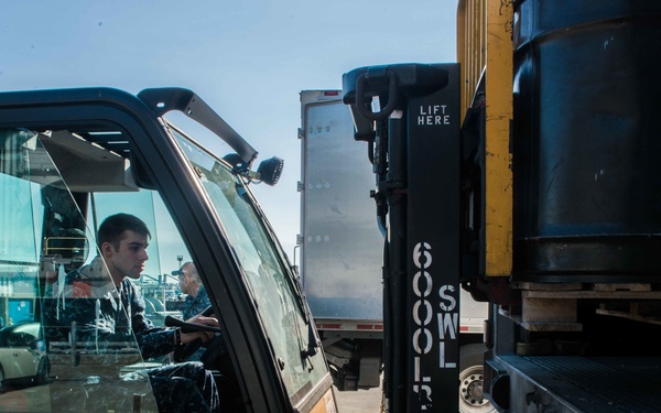 Sailor Operates Forklift