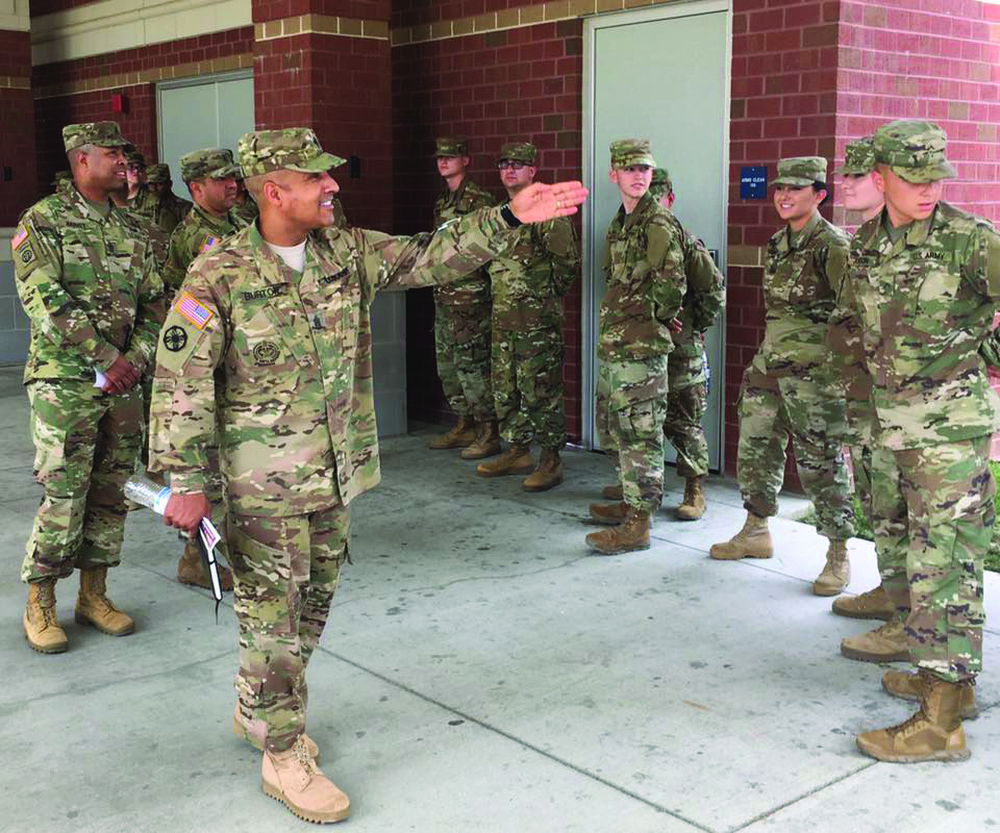 Why are soldiers often told not to march in unison over a bridge