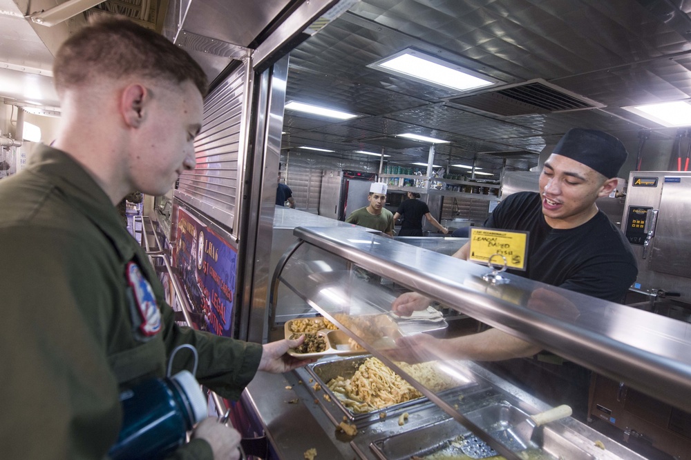 15th MEU Marine serves dinner to the USS America crew