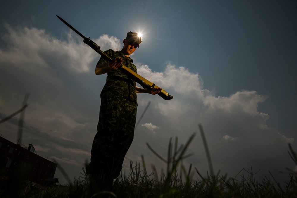 Navy's Ceremonial Guard Trains During Eclipse