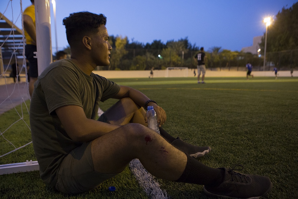 Marines, Sailors participate in a game of soccer with Jordanians