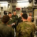 USAF-R C-17 pilot Maj. Chance Harridge briefs U.S. Army Airborne on upcoming drop