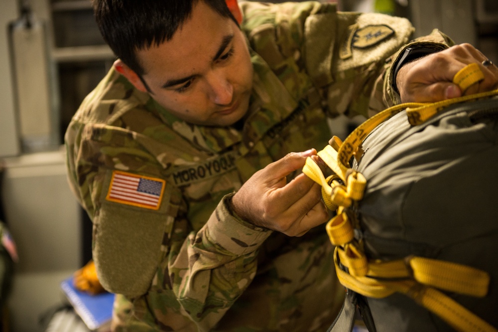 Army rigger prepares soldiers for C-17 drop near JB Elmendorf-Richardson, AK