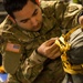 Army rigger prepares soldiers for C-17 drop near JB Elmendorf-Richardson, AK