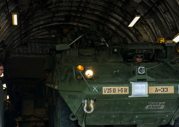 317th AS loadmasters unload Stryker IAV from C-17