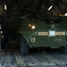 317th AS loadmasters unload Stryker IAV from C-17