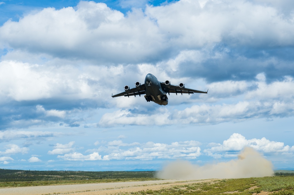 C-17 takes off from dirt-and-gravel strip northeast of JB Elmendorf-Richardson, AK