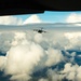 317th AS C-17 flying above the cloud cover north of JB Elmendorf-Richard, AK