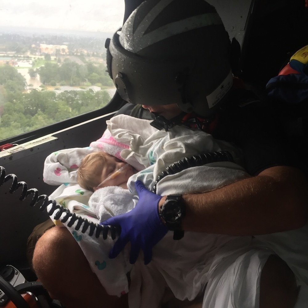Coast Guard aircrew assists infant during the aftermath of Hurricane Harvey
