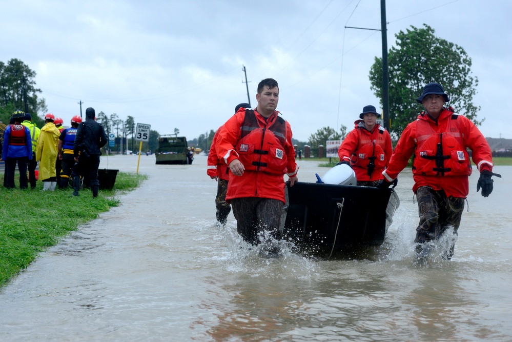 Coast Guard members evacuate survivors of Hurricane Harvey