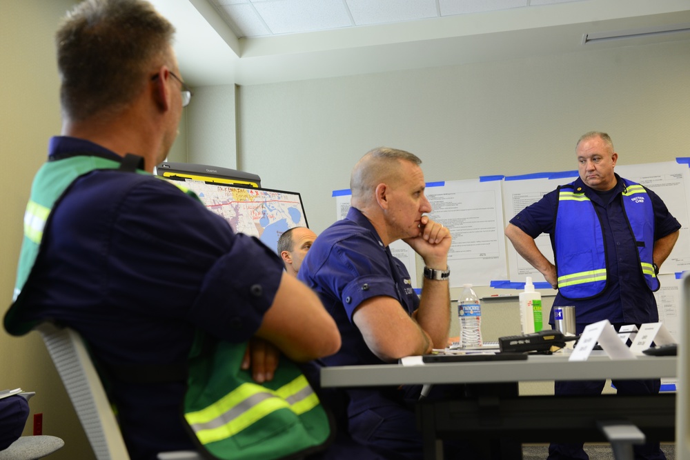 The Coast Guard's incident command post members meet