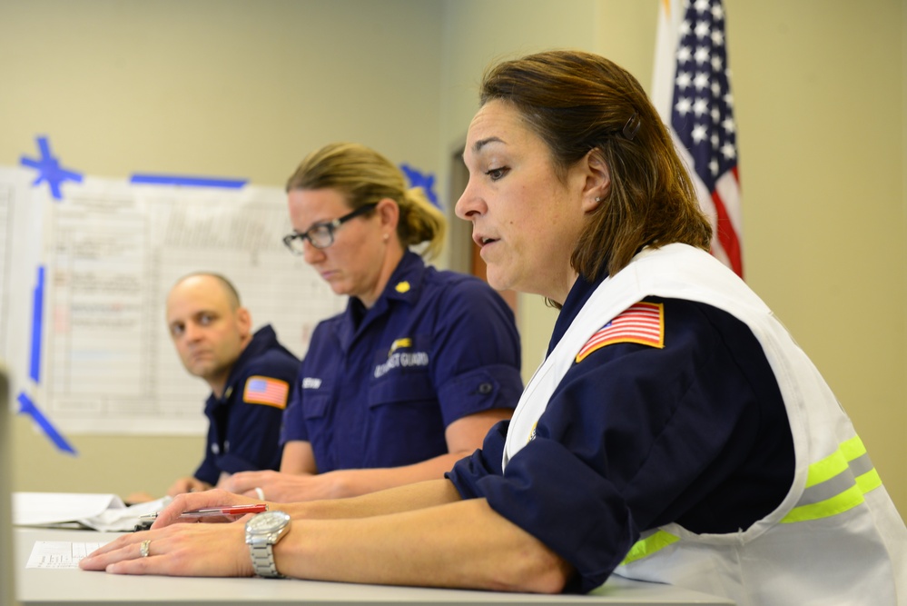 The Coast Guard's incident command post members meet