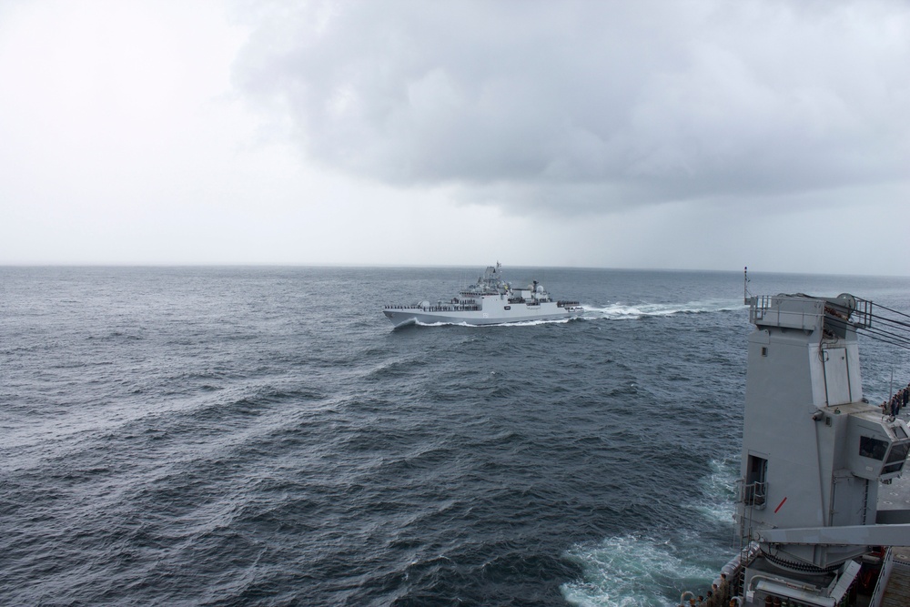 USS Pearl Harbor manuevers with the INS Trikand during live-fire gunnery exercise