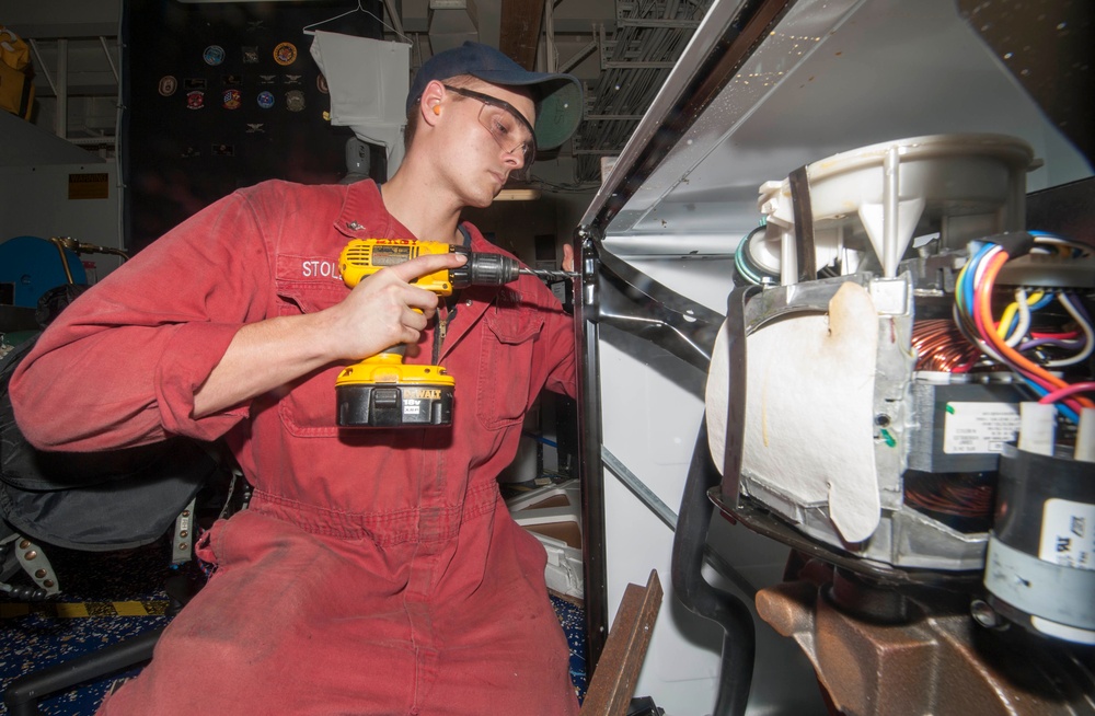 Sailor installs washer