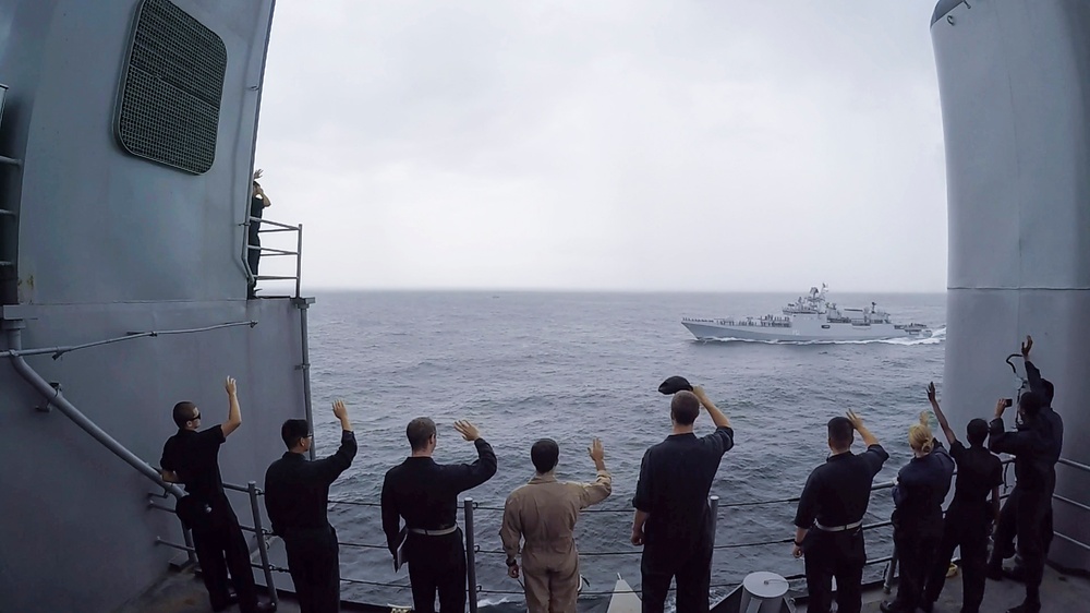 USS Pearl Harbor manuevers with the INS Trikand during live-fire gunnery exercise