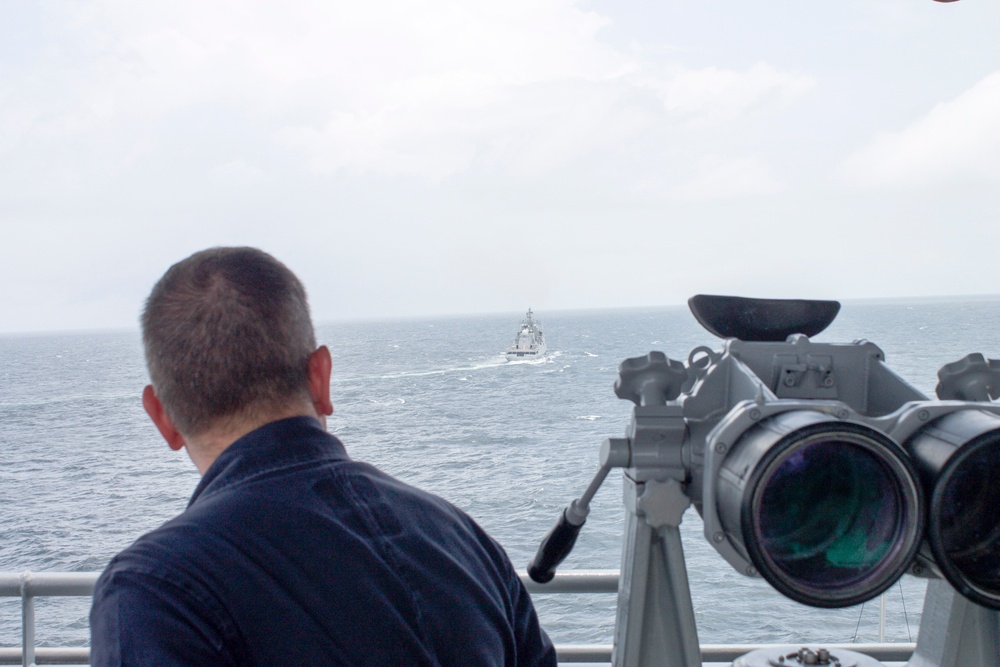 USS Pearl Harbor manuevers with the INS Trikand during live-fire gunnery exercise