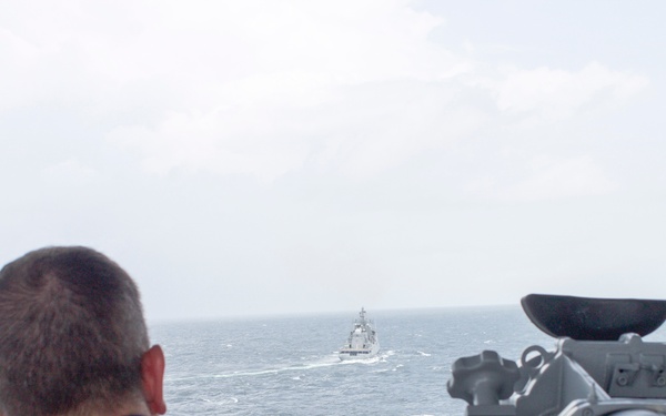 USS Pearl Harbor manuevers with the INS Trikand during live-fire gunnery exercise