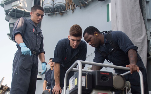 USS Lake Erie (CG 70) Sailors perform maintenance on the P-100