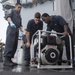 USS Lake Erie (CG 70) Sailors perform maintenance on the P-100