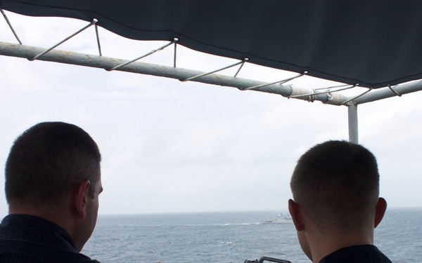 USS Pearl Harbor manuevers with the INS Trikand during live-fire gunnery exercise