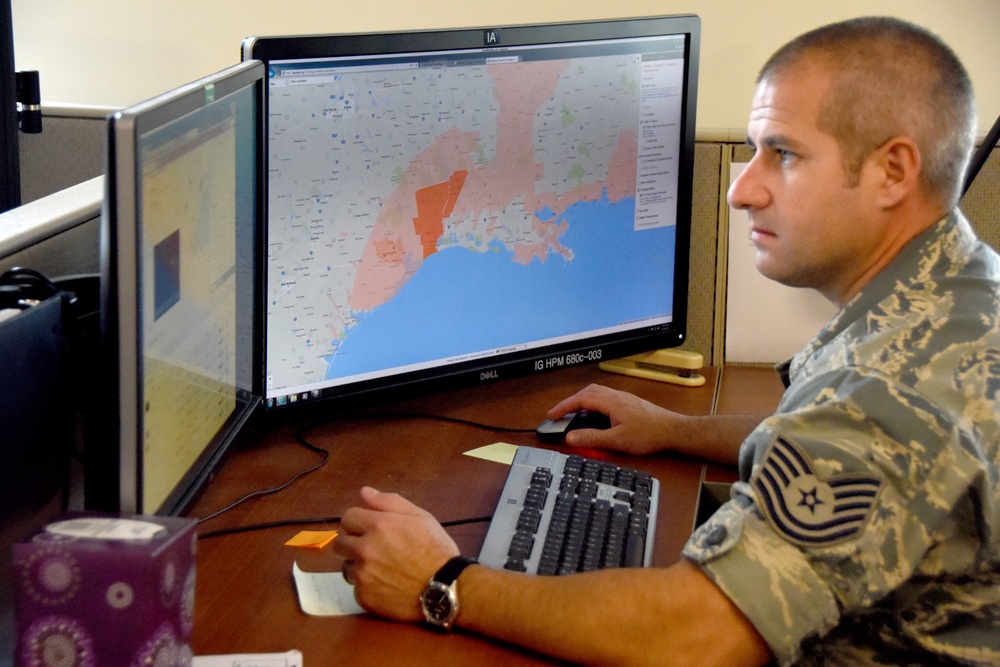 178th Wing members analyzing airborne and commercial satellite imagery remotely from the 178th Wing, Springfield Ohio Air National Guard base, providing information to a liaison officer located in Austin Texas in relief assistance in the aftermath of Hur