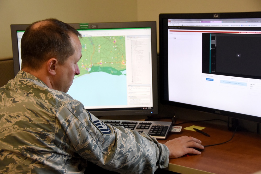 178th Wing members analyzing airborne and commercial satellite imagery remotely from the 178th Wing, Springfield Ohio Air National Guard base, providing information to a liaison officer located in Austin Texas in relief assistance in the aftermath of Hur