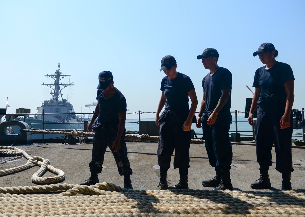 Sailors Heave Mooring Line