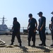 Sailors Heave Mooring Line