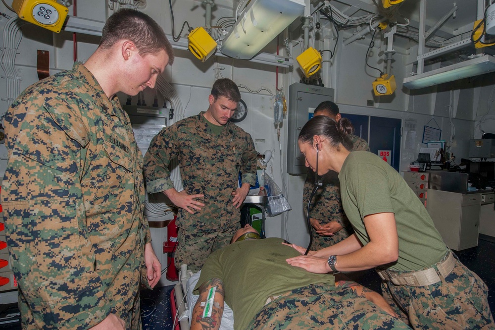 Sailors conduct patient assessment