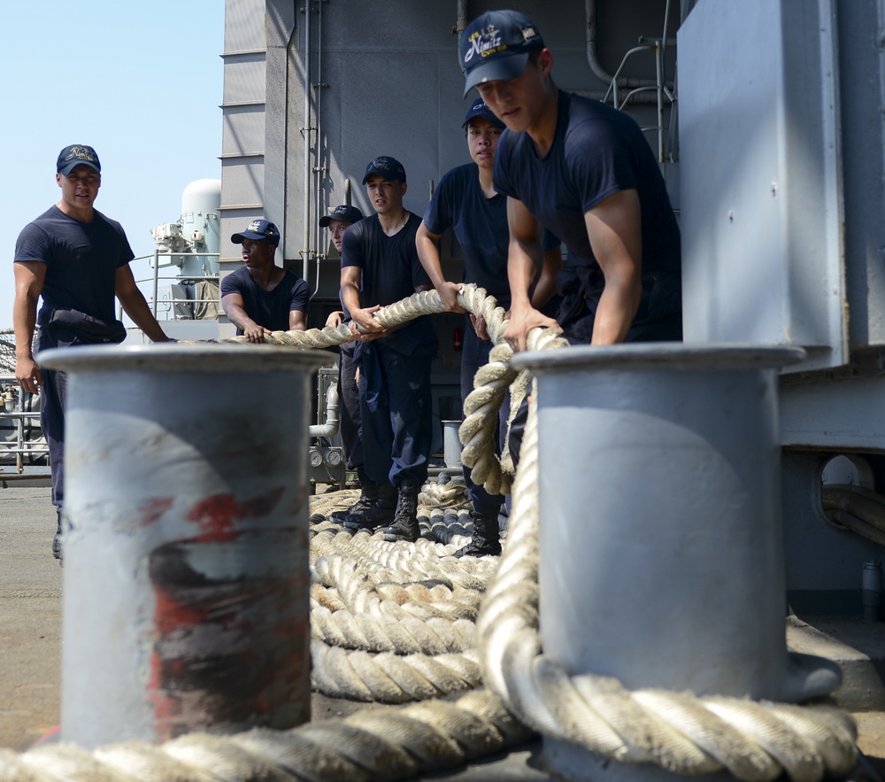 Sailors Heave On A Mooring Line