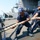 Sailors Heave On Mooring Line